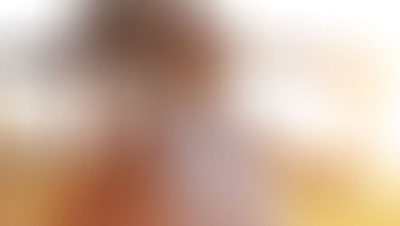 A woman exercises outdoors under the sunlight.