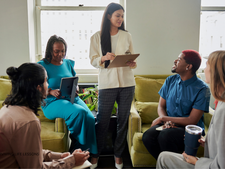 A confident woman leads a discussion with her team.