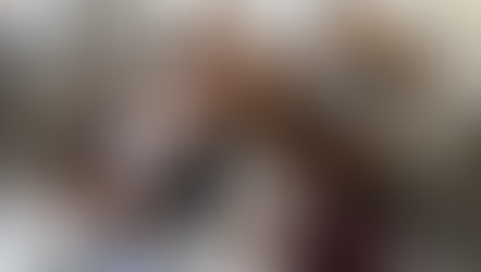 A diverse team joins hands in unity and celebration, showing teamwork, trust, and shared success.