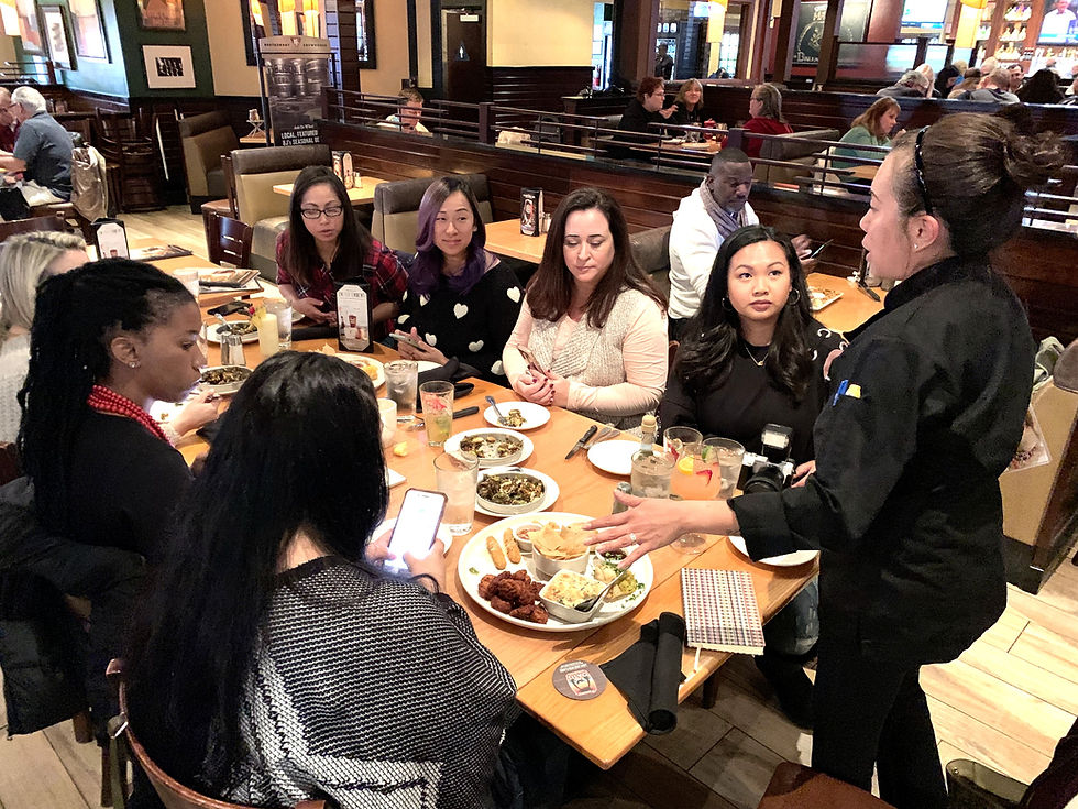 Leanne explaining the BJ's Restaurant & Brewhouse menu to LA Mommy Blogger Tribe