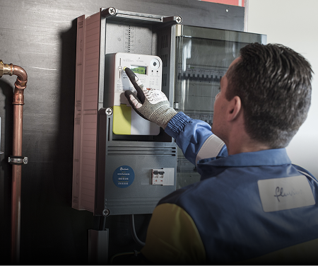 Technician adjusting a smart meter