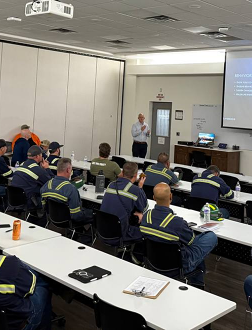 Instructor leading a safety training for workers.