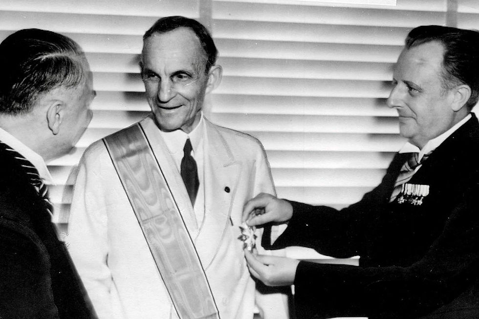 Henry Ford receiving the Grand Cross of the German Eagle from Nazi officials, 1938. (Photo by AP). Source: https://rarehistoricalphotos.com/henry-ford-grand-cross-1938