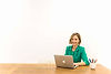 Woman on desk with her laptop