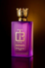 Glass perfume bottle with a golden cap on a minimalist background.