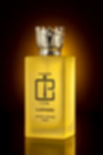 Glass perfume bottle with a golden cap on a minimalist background.