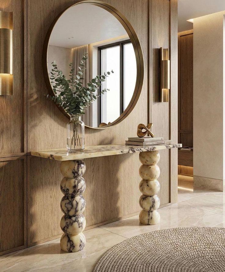 Floating exotic marble console table in a luxury apartment foyer.