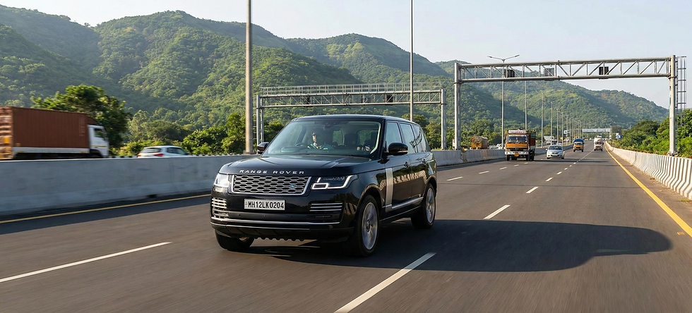 Luxury SUV driving on the newly expanded Mumbai-Pune expressway.