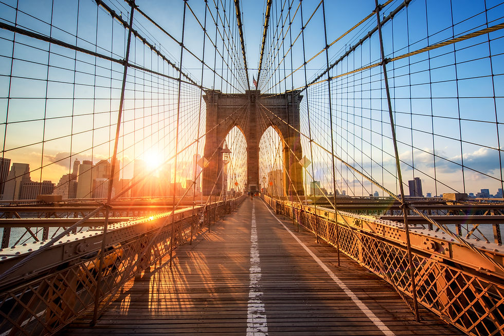 A pedestrian bridge extending straight toward the horizon, symbolizing continuity and sustained progress over time.