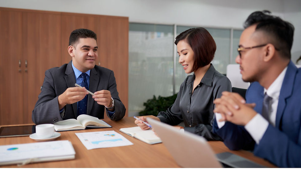 three employees having a meeting