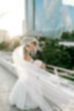 Modern architecture backdrop for wedding ceremony at Milwaukee Art Museum.