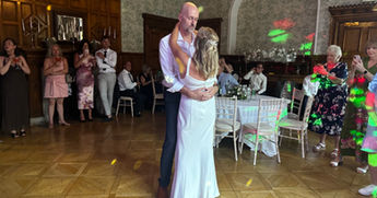 Hollie Marie with bride and groom as they share their first dance wedding reception at Pendly manor, Tring.