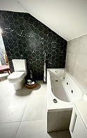 large bathroom with whirlpool bath and walk in shower