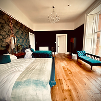 Large bedroom with 2 kingsize beds and views over the bay