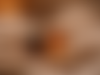 Warm winter drinks in clear glass mugs on a soft neutral backround.