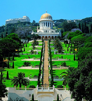 The terraced Baháʼí Gardens in Haifa surrounding a steep staircase that leads up to the gold-domed Shrine of the Báb