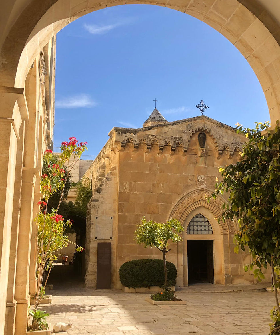 The stone-built courtyard of the Terra Sancta Museum and Church of the Flagellation, seen on a sunny day