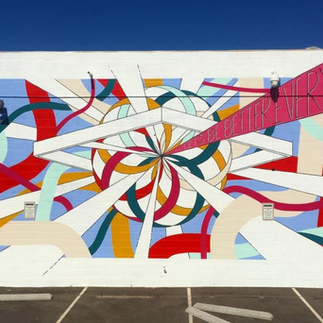 large mural with a circle at the center and colored lines coming out of it