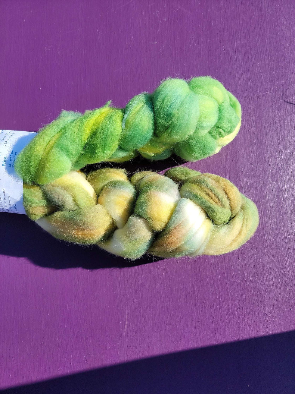 Thumbnail: Vibrant green to greens and hints of orange fibre braid dyed by Wyldespun