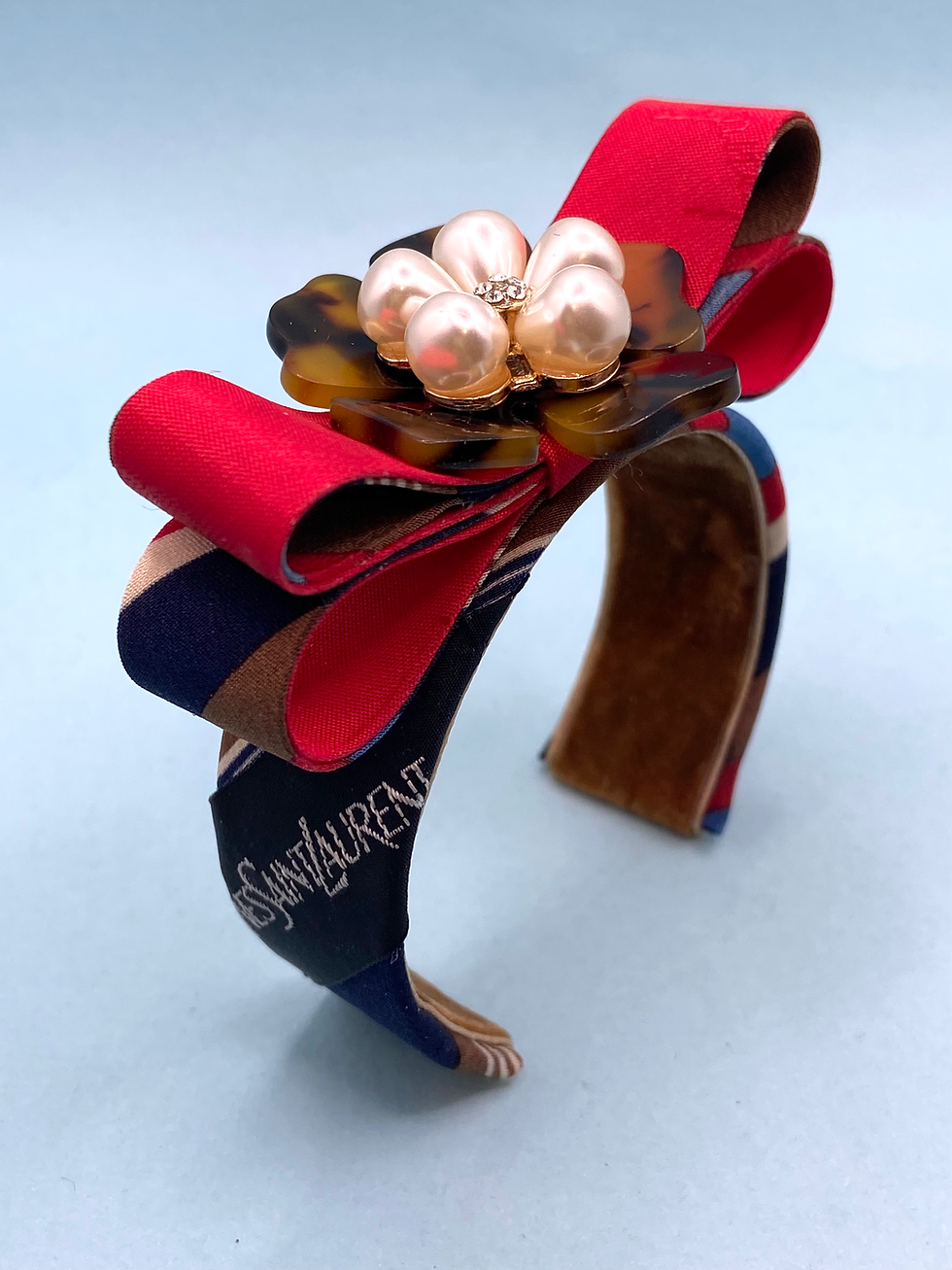 Tan, blue & red striped YSL logo cuff & red bow made from a vintage silk YSL tie