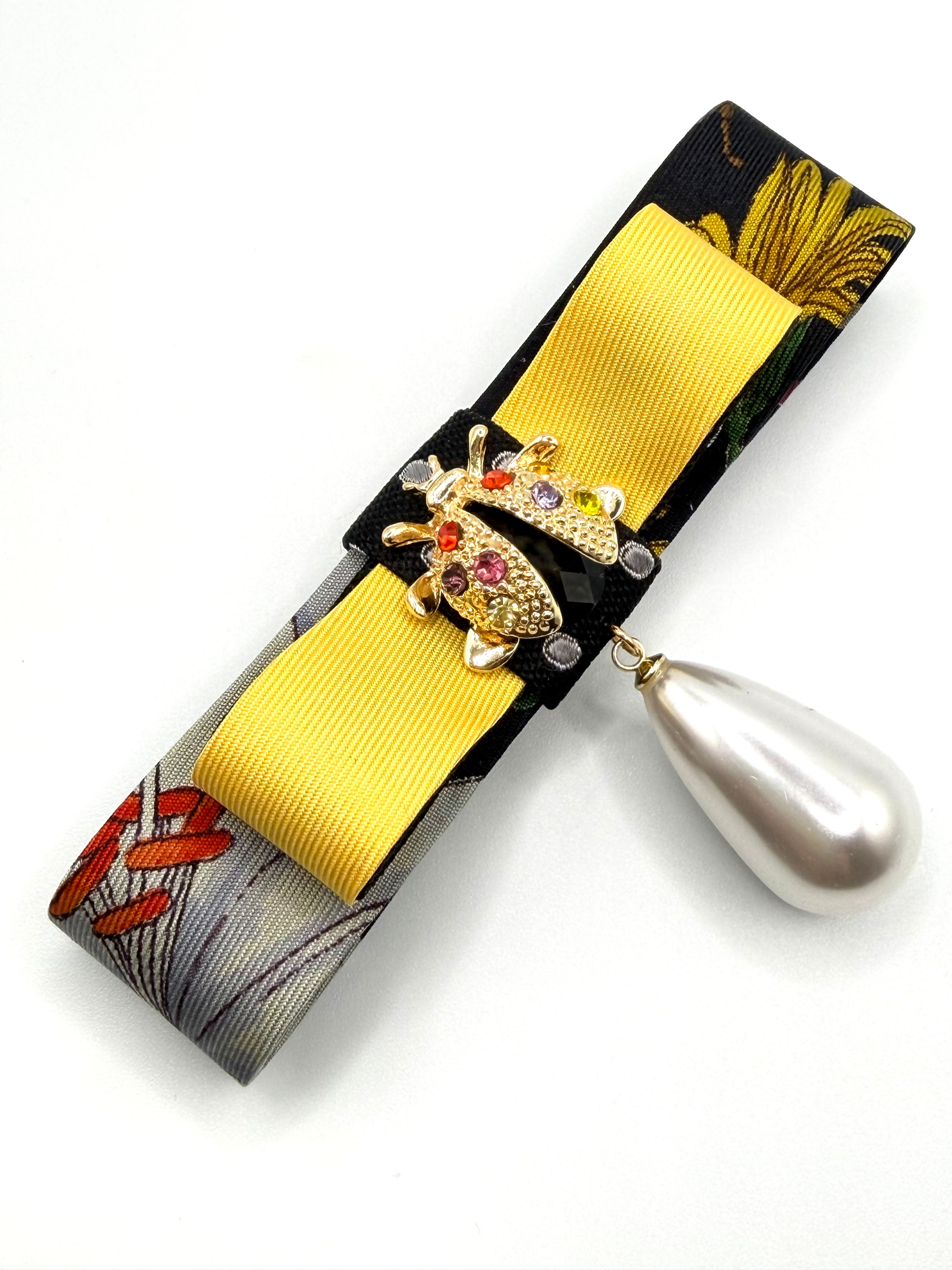Black & yellow flora bow brooch with ladybug made from a vintage silk Gucci tie