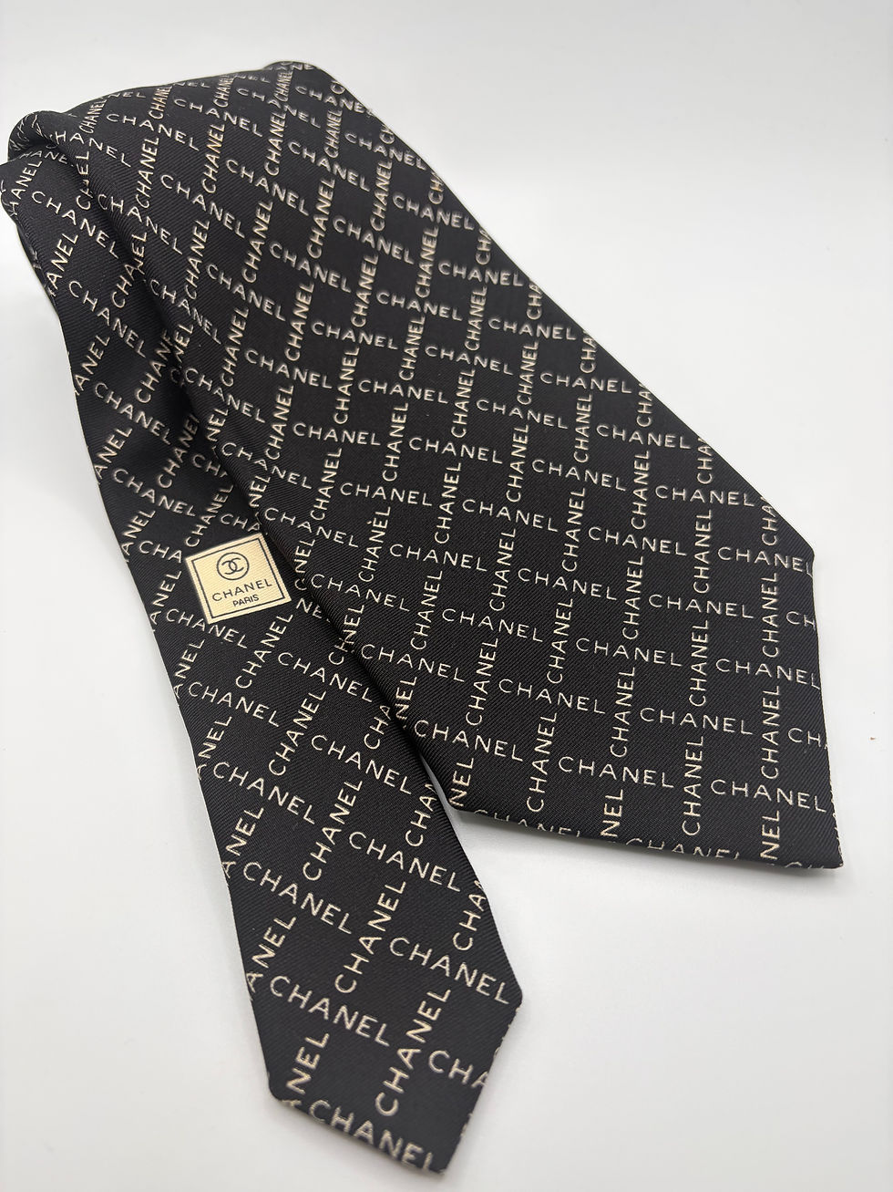 Thumbnail: Black & white Chanel logo cuff with flower made from a vintage Chanel silk tie