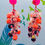 Thumbnail: Neon pink post earrings with glass Liberty cotton flowers