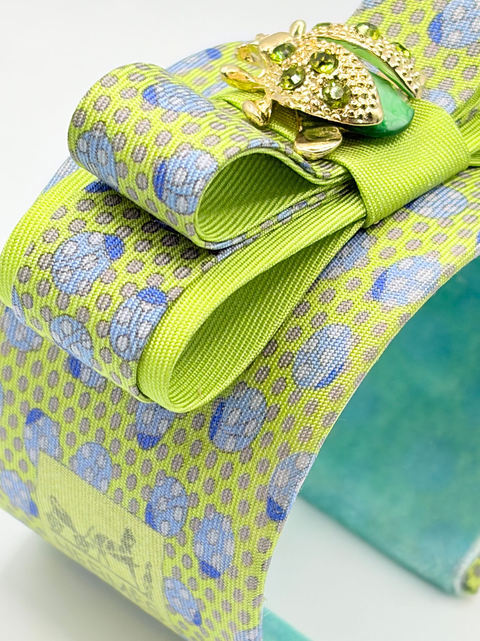 Thumbnail: Green ladybug print cuff made from a vintage Hermes silk tie