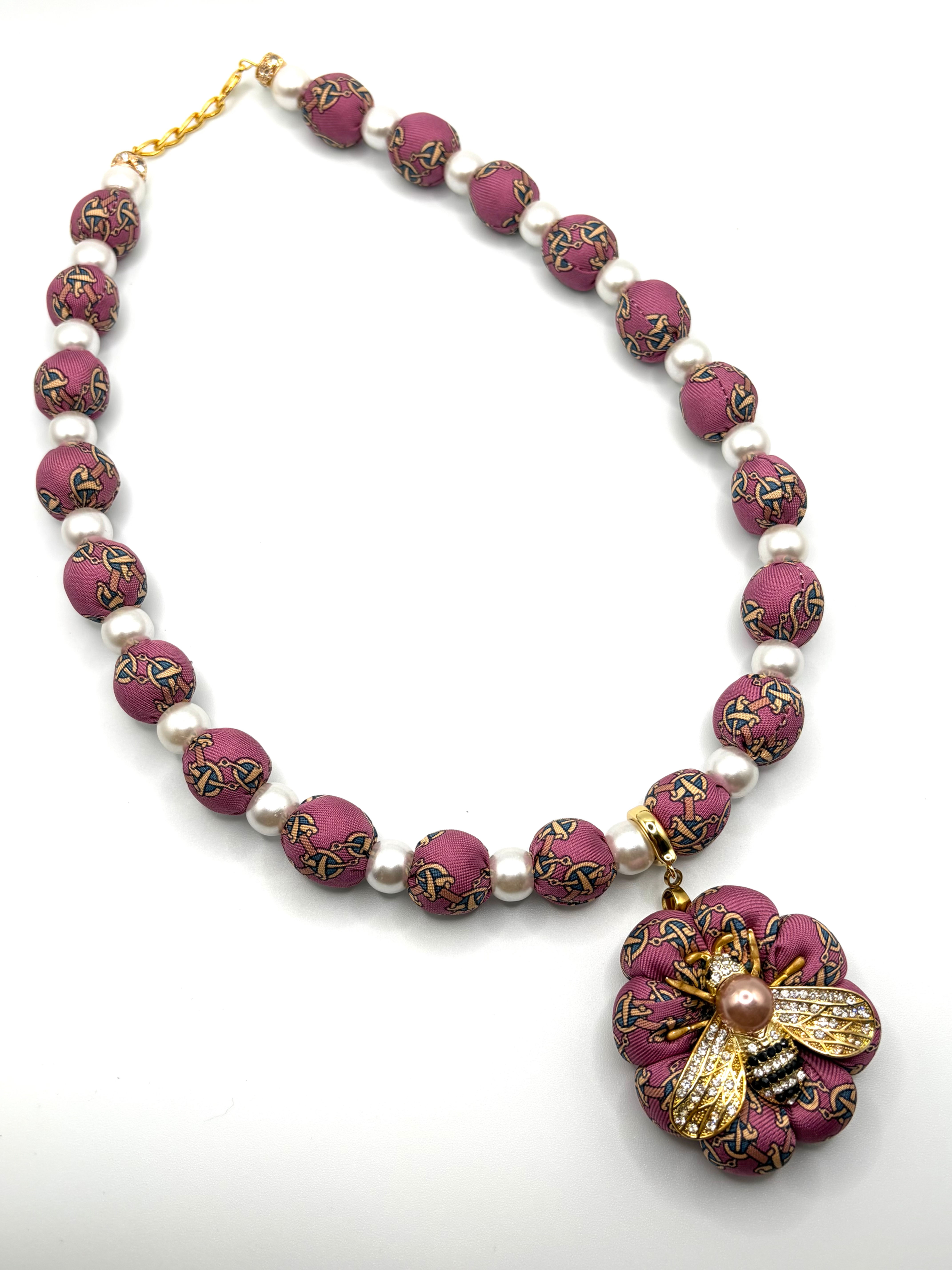 Rose pink equestrian print necklace made from a vintage Hermes silk necktie