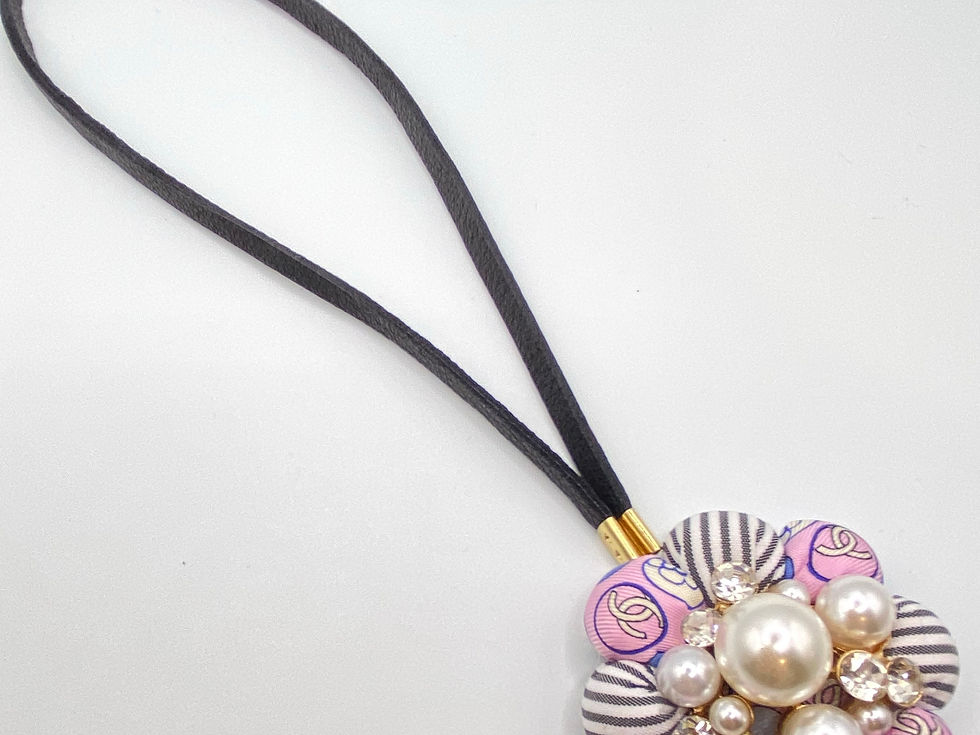 Thumbnail: Pink CC logo stripe & pearl bag charm made from a vintage Chanel silk tie