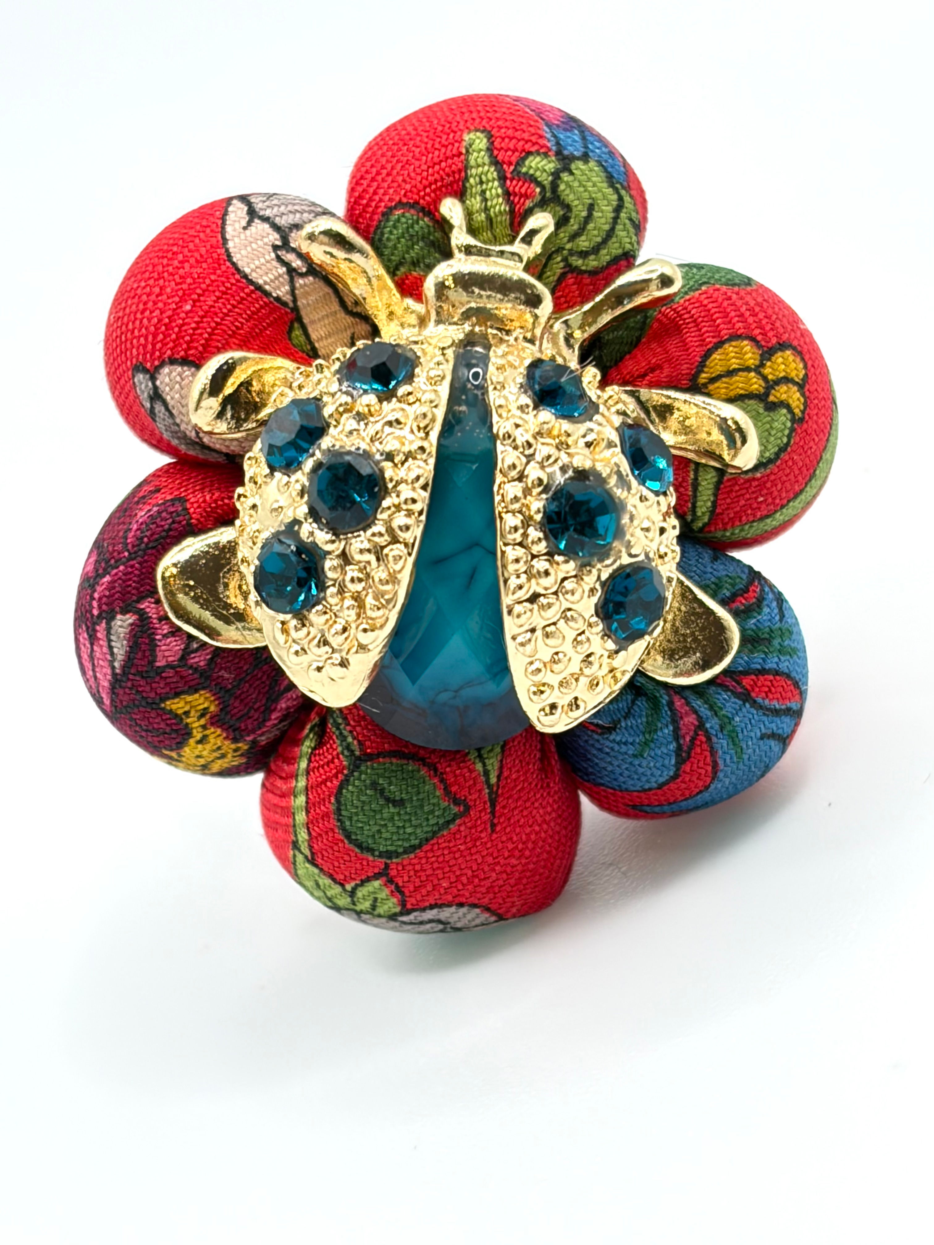 Red botanicals print ring with ladybug made from a vintage Gucci Flora silk tie