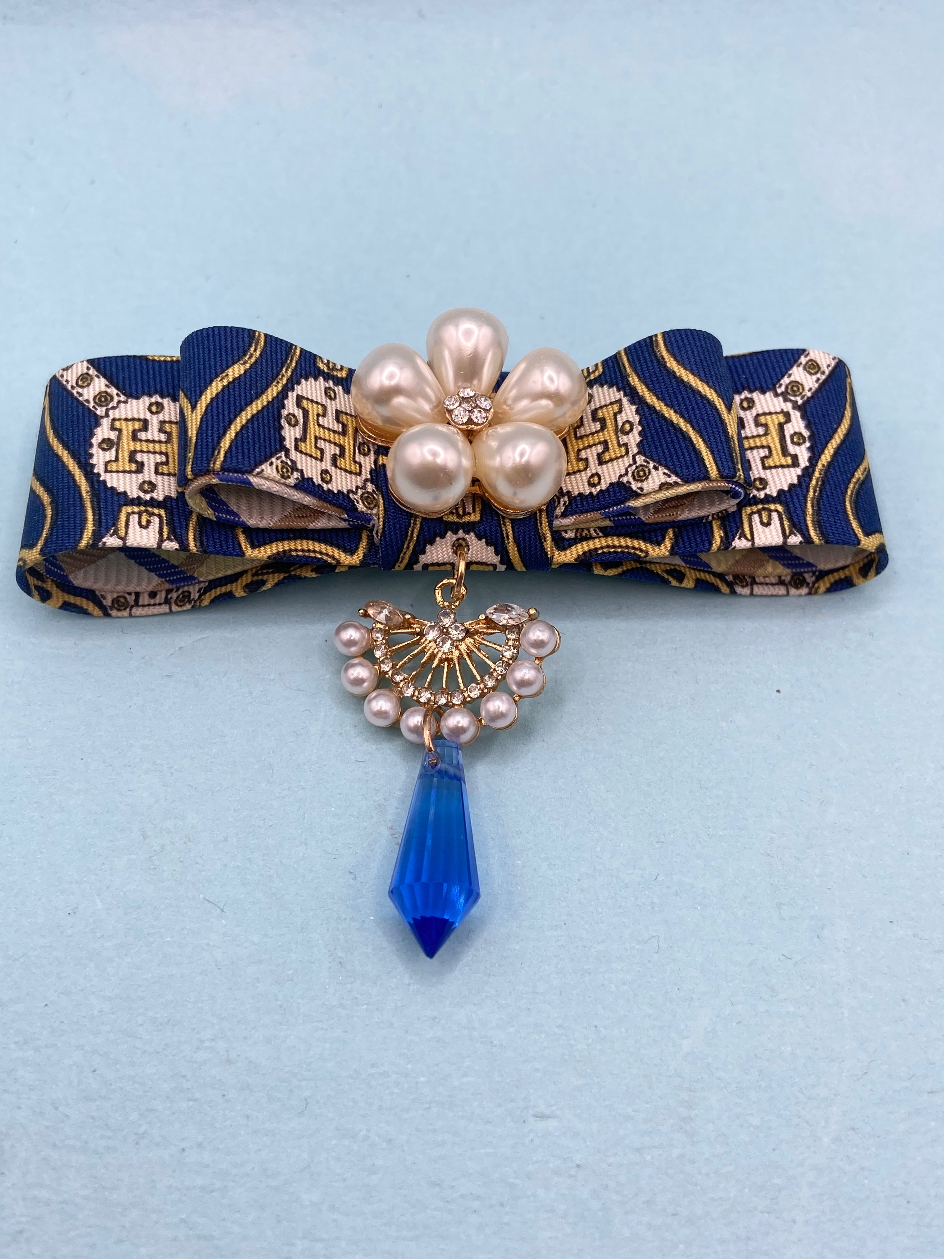 Blue & yellow H & straps print bow brooch made from vintage Hermes silk tie