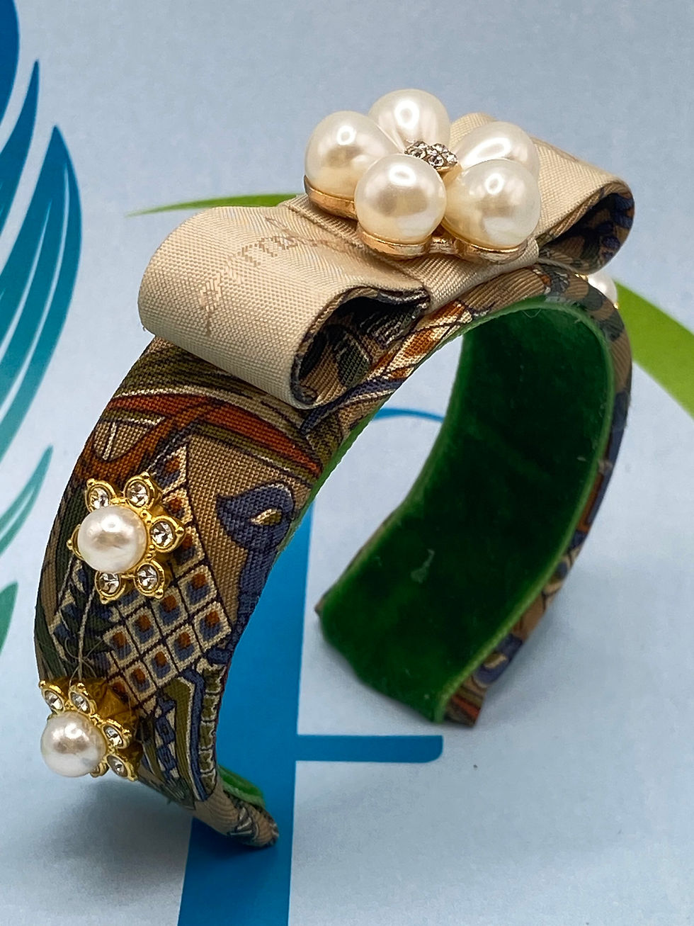Moroccan themed cuff with bow & pearls made from upcycled Ferragamo silk tie.