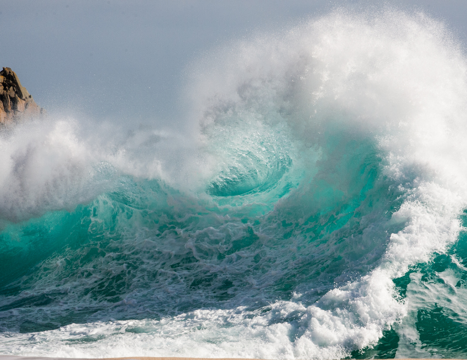 Powerful blue waves with white spray