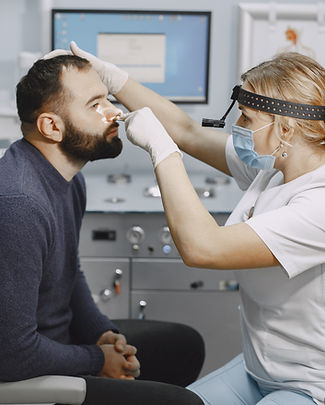otolaryngologist-preparing-medical-examination-procedure.jpg