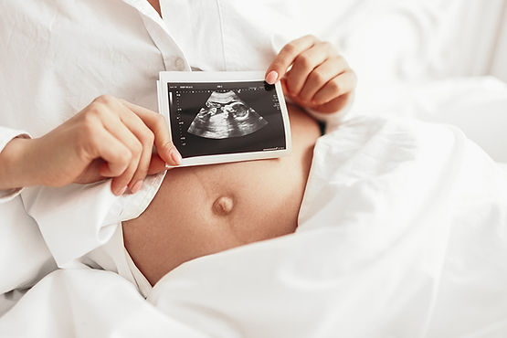 Obstetrics pregnant-woman-with-sonogram-image-2023-11-27-05-00-23-utc.jpg