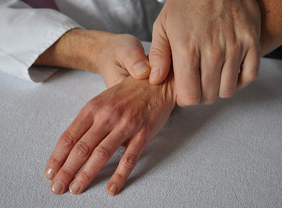 hands-of-a-physician-treating-a-patient-s-hand-2023-11-27-05-13-31-utc.jpg