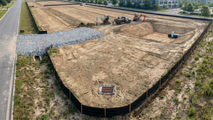 Construction site with erosion control measures and stormwater BMPs installed before grading begins