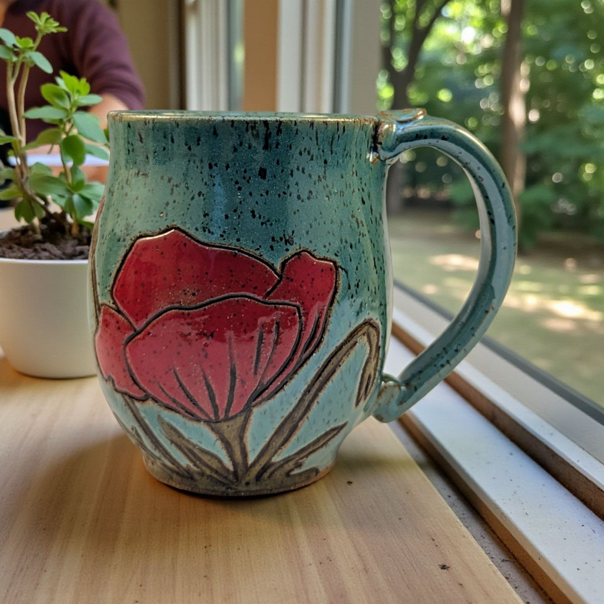 Poppy flower handmade stoneware pottery mug in nutty green