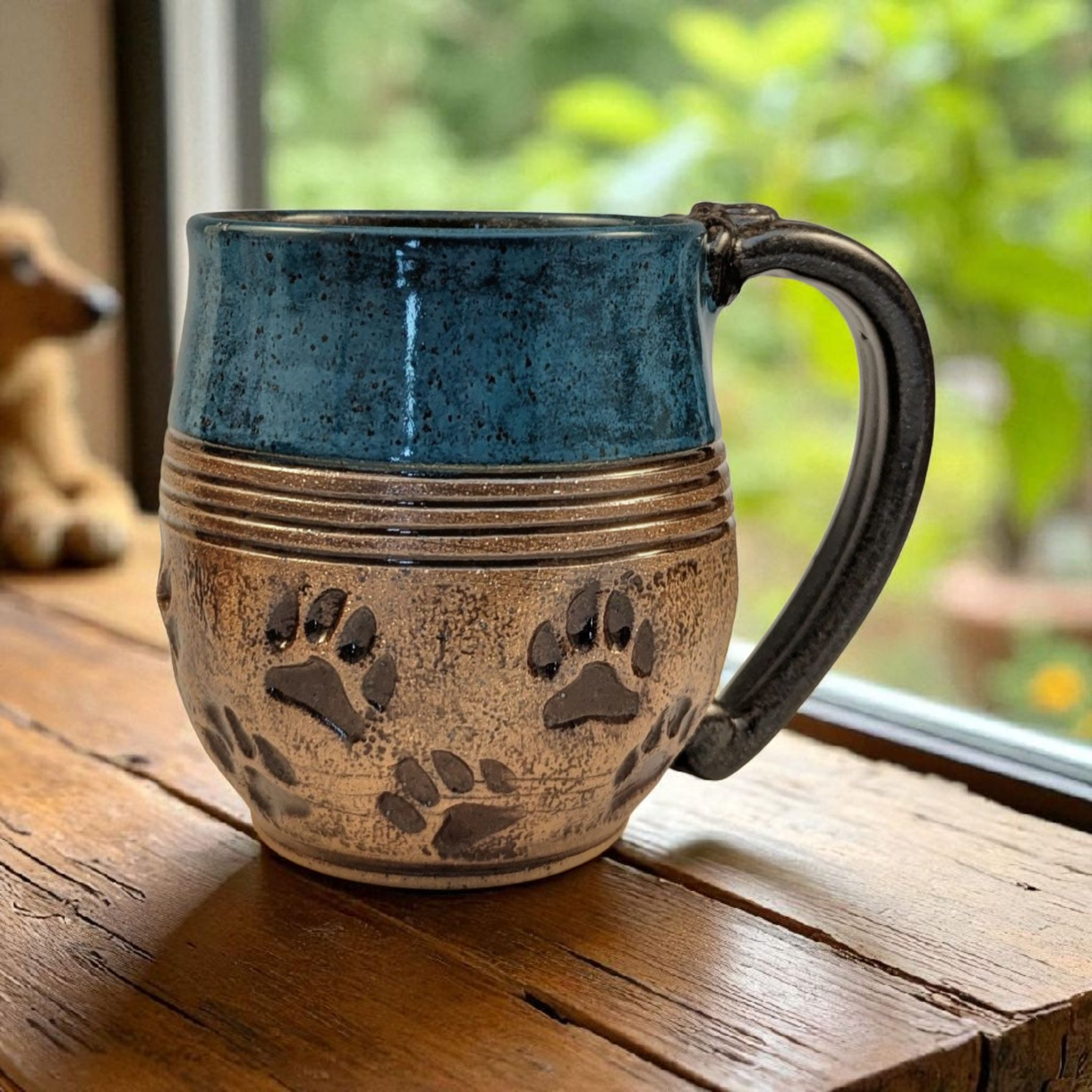 Paw print in power turquoise