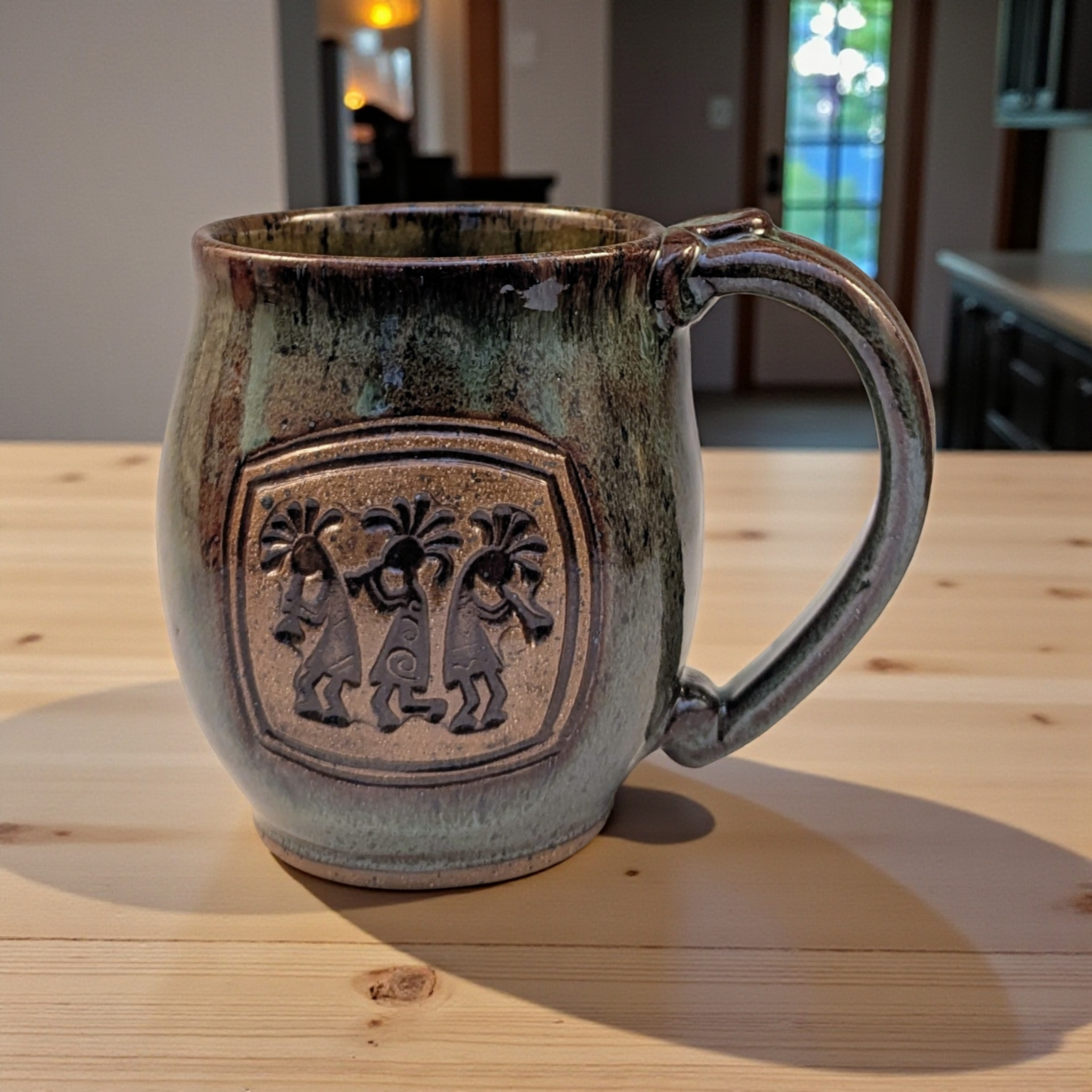 Kokopeli in green fir