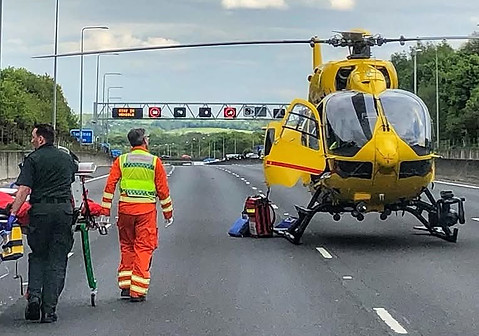 Heli on motoraway walking towards heli.jpg