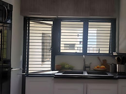 Cat proof invisible grill installed in Singapore HDB kitchen, slim design with narrow gaps to keep cats safe while allowing ventilation and light