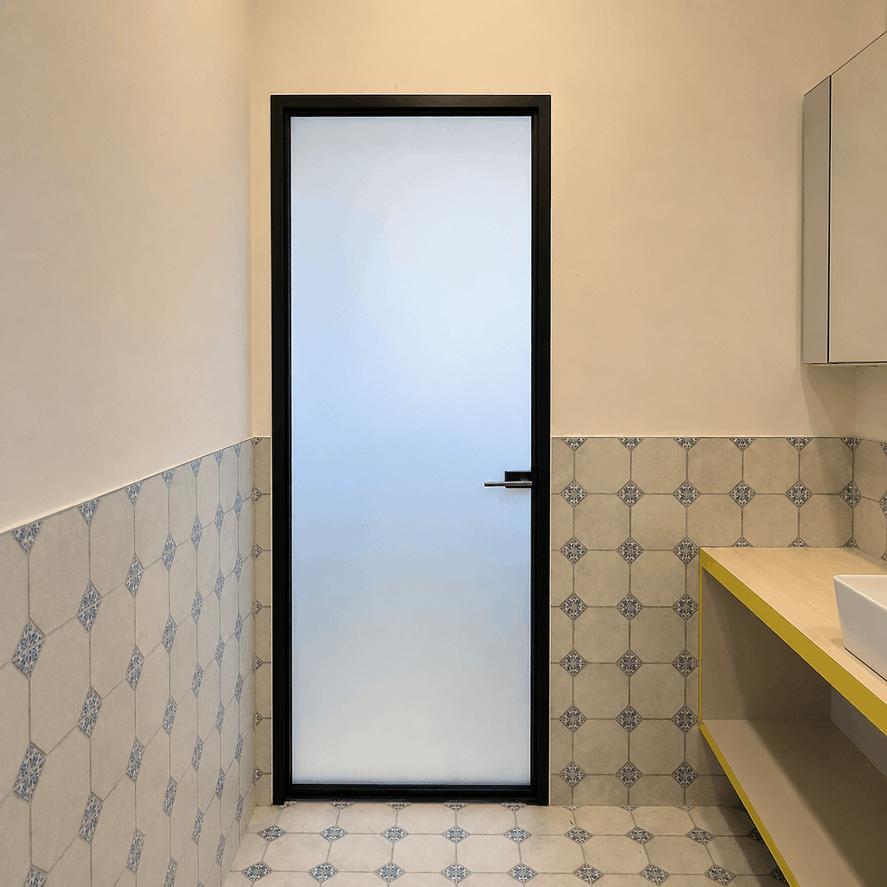 Ultra slim swing door with frosted glass and black aluminium frame installed in modern Singapore bathroom with patterned wall