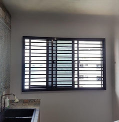 Window grill for cat installed in Singapore HDB kitchen, aluminium sliding grille with narrow 2-inch gaps for pet safety and ventilation
