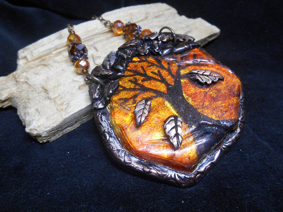 The Turning of the Leaves polymer clay pendant