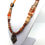 Miniature : Collier "Afrika" perles diverses et masque en bronze