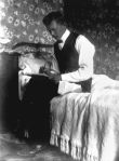 StateLibQld_2_171951_Intimate_portrait_of_a_man_writing_a_letter,_1900-1910