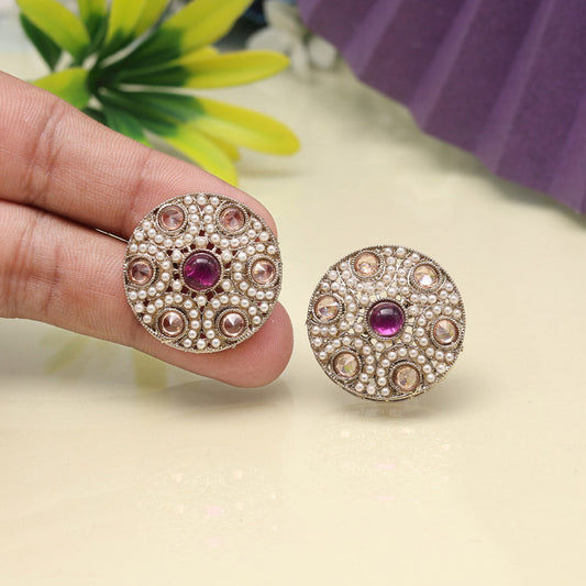 Round pearl earrings with purple gemstone