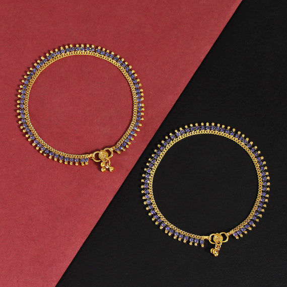 Elegant gold anklets with blue stones
